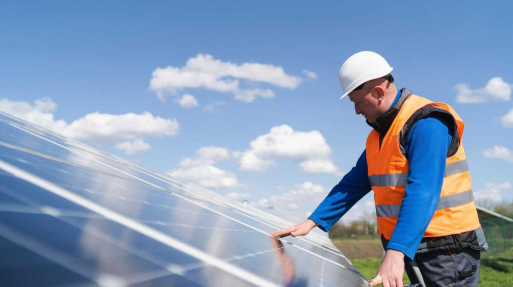 Solar power plant engineer makes a visual inspection of solar panels